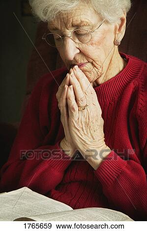 Woman prays View Large Photo Image Stock Photo - Woman prays. Fotosearch