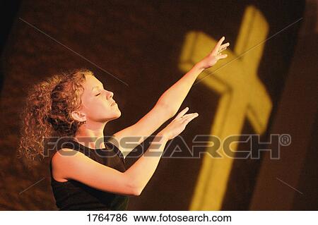 Woman worshipping View Large Photo Image Stock Photograph - Woman worshipping. Fotosearch