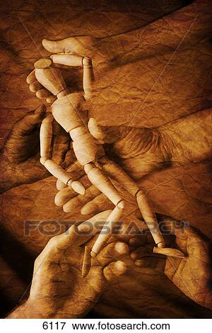Stock Photo - Wooden marionette being supported by hands. Fotosearch
