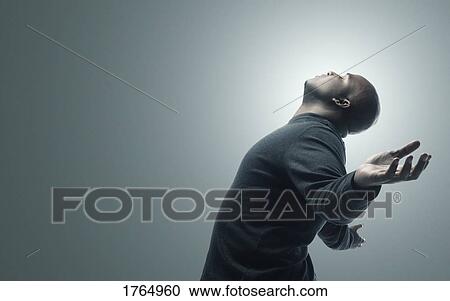 Man with arms raised View Large Photo Image Stock Image - Man with arms raised. Fotosearch