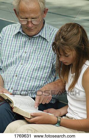 Reading together View Large Photo Image Stock Image - Reading together. Fotosearch