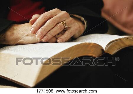 Senior praying with open bible View Large Photo Image Stock Photo - Senior praying with open bible. Fotosearch
