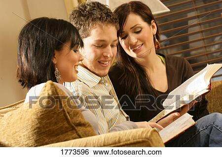 Teenagers studying the Bible View Large Photo Image Stock Photograph - Teenagers studying the Bible. Fotosearch