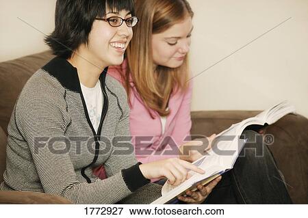 Stock Photo - Two women studying. Fotosearch