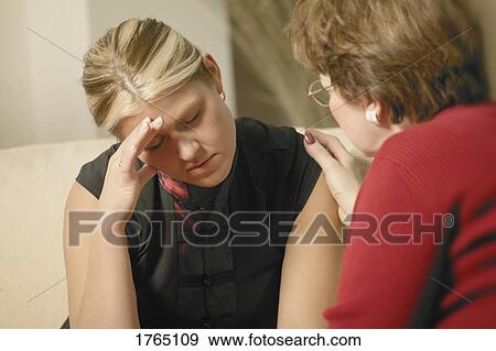 Stock Photo - Woman is comforted. Fotosearch