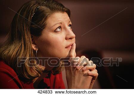Stock Image - Woman praying. Fotosearch