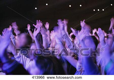 Stock Photograph - Worship service hands raised. Fotosearch