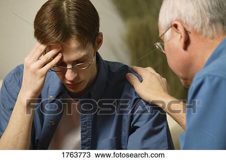 Young man getting help View Large Photo Image Stock Image - Young man getting help. Fotosearch
