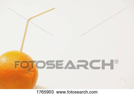 An orange with a straw View Large Photo Image Stock Image - An orange with a straw. Fotosearch