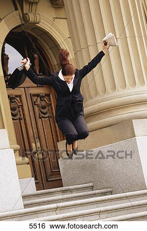 Businesswoman jumping for joy View Large Photo Image Stock Photograph - Businesswoman jumping for joy. Fotosearch