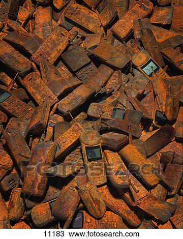 Stock Image - Discarded cell phones. Fotosearch