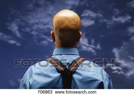 Man looks at the sky View Large Photo Image Stock Image - Man looks at the sky. Fotosearch