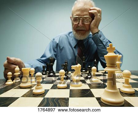 Playing a game of chess View Large Photo Image Stock Photo - Playing a game of chess. Fotosearch