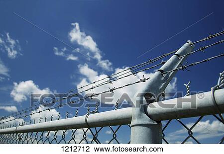 A restrictive fence View Large Photo Image Stock Image - A restrictive fence. Fotosearch