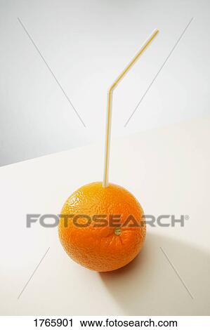 An orange with a straw View Large Photo Image Stock Image - An orange with a straw. Fotosearch