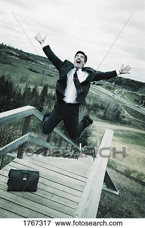 Businessman leaps for joy View Large Photo Image Stock Photo - Businessman leaps for joy. Fotosearch