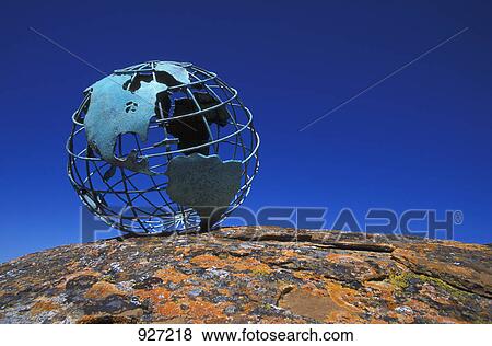 Globe on rock View Large Photo Image Stock Photo - Globe on rock. Fotosearch