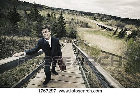 Man climbs stairs View Large Photo Image Stock Photo - Man climbs stairs. Fotosearch