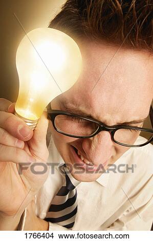 Man with light bulb View Large Photo Image Picture - Man with light bulb. Fotosearch