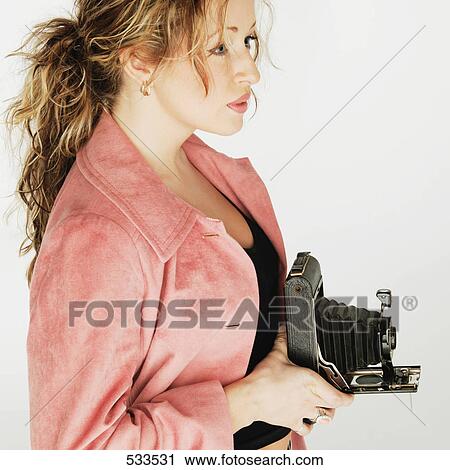 Stock Image - Woman photographer. Fotosearch