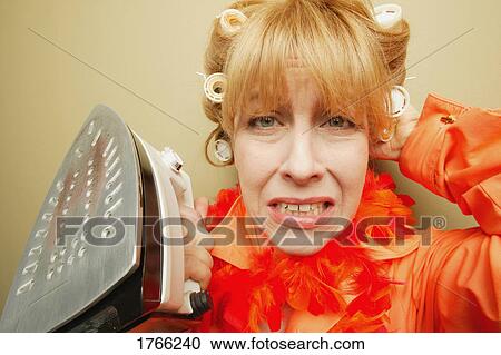 Woman with iron View Large Photo Image Stock Image - Woman with iron. Fotosearch