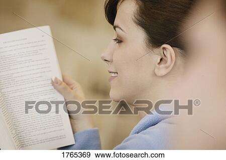 Stock Photo - A student with a book. Fotosearch