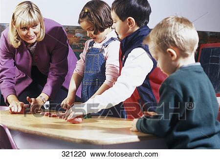 Children playing with supervisor View Large Photo Image Stock Image - Children playing with supervisor. Fotosearch