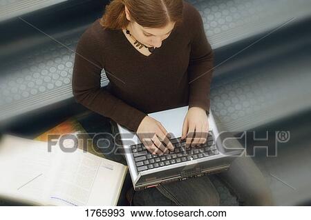 Stock Image - Girl on a lap top. Fotosearch