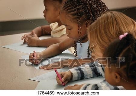 Group of children color in class View Large Photo Image Stock Photo - Group of children color in class. Fotosearch