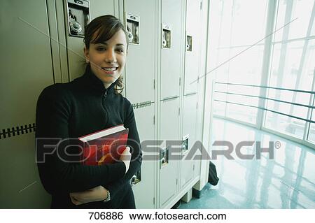 Stock Photograph - Student hangs out in hallway. Fotosearch