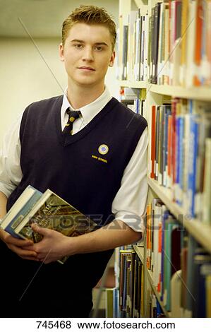 Student in the library View Large Photo Image Stock Photo - Student in the library. Fotosearch