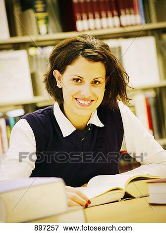 Student studying in library View Large Photo Image Stock Photo - Student studying in library. Fotosearch