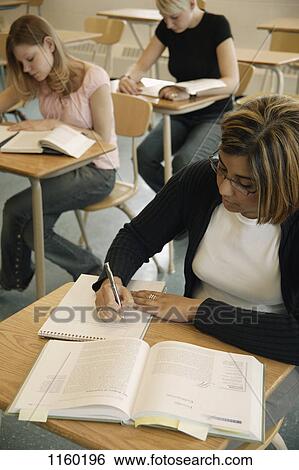Stock Photograph - Students doing an assignment. Fotosearch