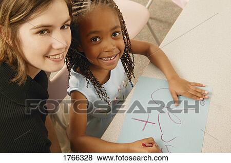 Teacher and child View Large Photo Image Stock Photo - Teacher and child. Fotosearch