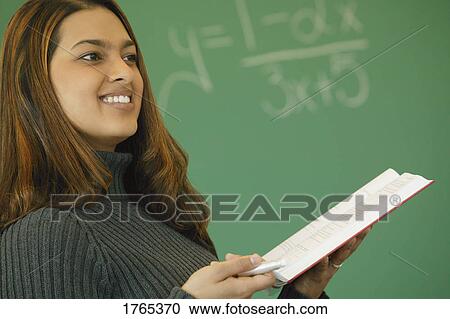 Teacher teaches class View Large Photo Image Stock Image - Teacher teaches class. Fotosearch