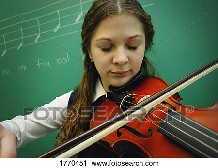 Girl playing violin View Large Photo Image Stock Image - Girl playing violin. Fotosearch