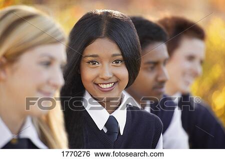 Stock Photograph - Girl posing in school uniform. Fotosearch