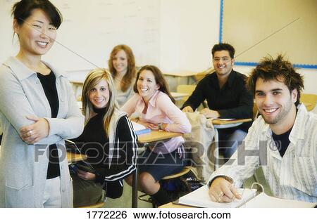 Stock Photograph - Group of students in class with Teacher. Fotosearch