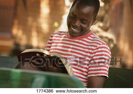 Man reading the bible View Large Photo Image Stock Photograph - Man reading the bible. Fotosearch