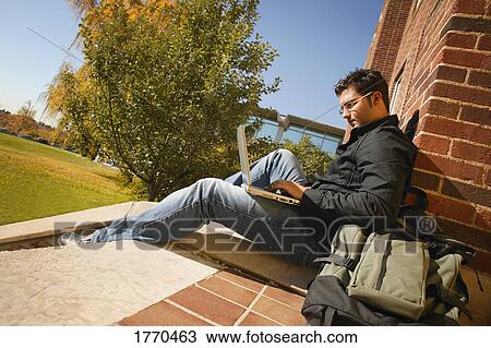 Man working on laptop View Large Photo Image Stock Image - Man working on laptop. Fotosearch
