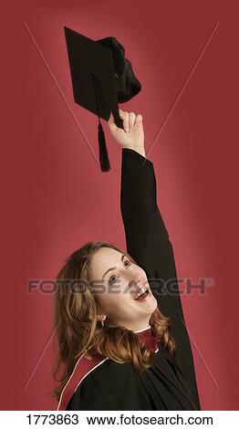 Portrait of graduate holding cap View Large Photo Image Stock Image - Portrait of graduate holding cap. Fotosearch
