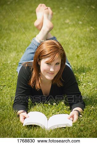 Reading a book View Large Photo Image Stock Image - Reading a book. Fotosearch