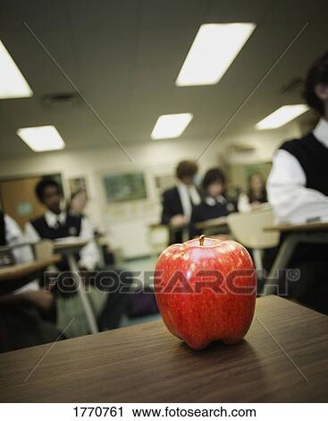 Red apple on classroom desk View Large Photo Image Stock Image - Red apple on classroom desk. Fotosearch