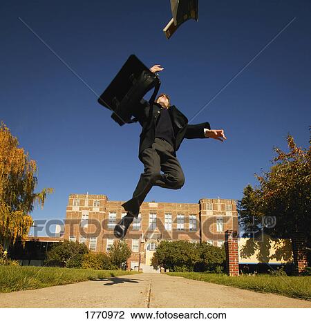 Stock Image - Student celebrating. Fotosearch
