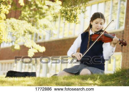 Stock Photograph - Teen girl playing violin. Fotosearch