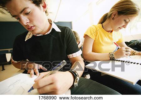 Stock Image - Working in class. Fotosearch