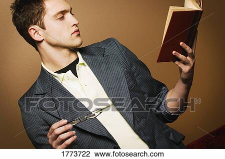 Young man reading View Large Photo Image Stock Image - Young man reading. Fotosearch