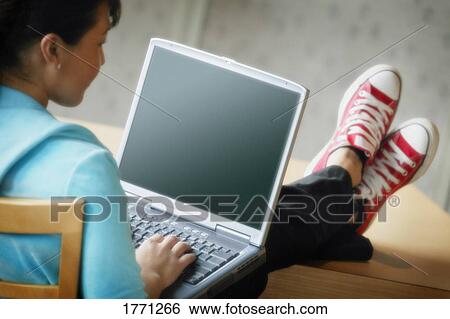 Young woman with laptop View Large Photo Image Stock Photograph - Young woman with laptop. Fotosearch