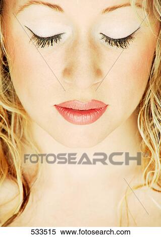 Stock Photography - A lady with eyes closed. Fotosearch