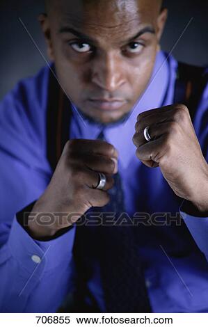 Businessman with defenses up View Large Photo Image Stock Photography - Businessman with defenses up. Fotosearch